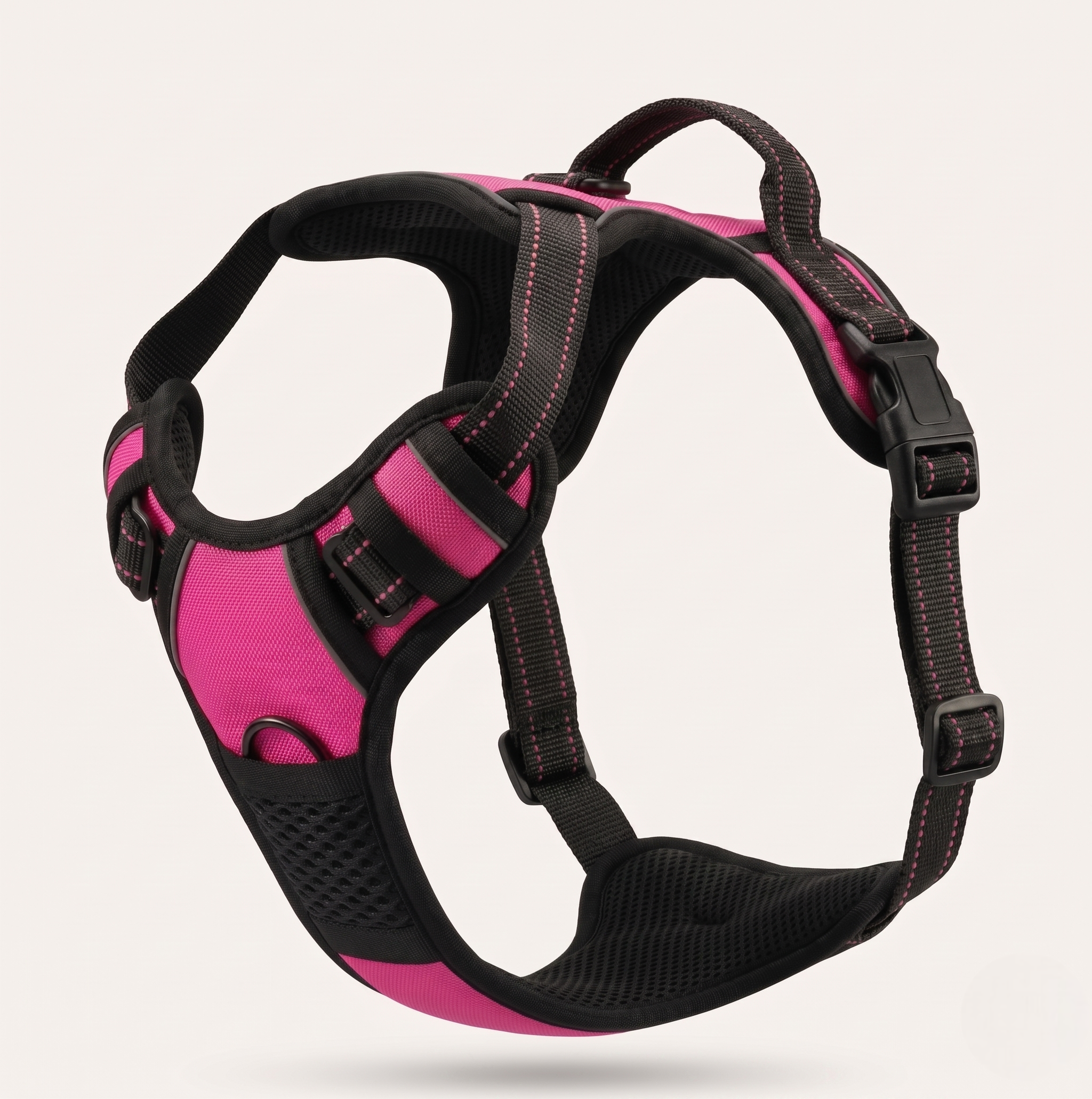 Harnais anti-traction et ergonomique pour chien de couleur rose, équipé de bandes réfléchissantes et d'une poignée de contrôle sur le dessus.